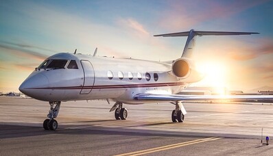 How much fuel does a private jet consume, and what are the environmentally-friendly solutions?